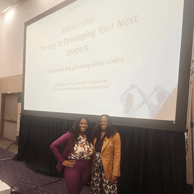 Two women presenting at a mentorship event.