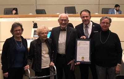 Residents and staff receiving a community proclamation.