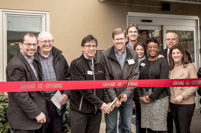 Group celebration for a grand re-opening event.