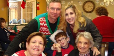 Residents and staff celebrating in a festive setting.