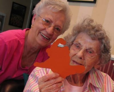 Staff and resident engaged in an activity