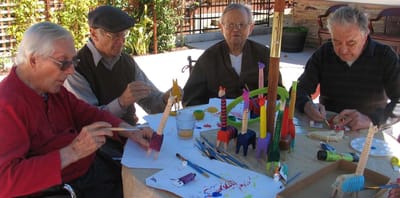 Seniors engaging in a creative arts and crafts activity.