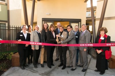 Ribbon-cutting ceremony for a facility's grand reopening.