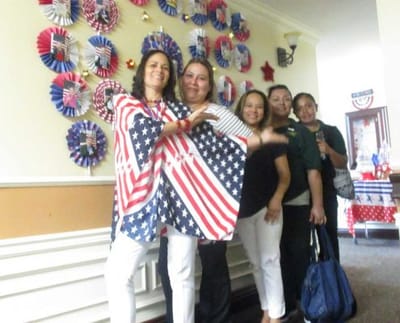 Staff and residents celebrating with patriotic decorations.