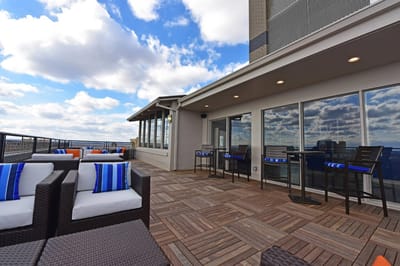 Outdoor sitting area with tables and chairs