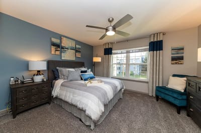 Cozy and well-decorated resident room with bed and décor