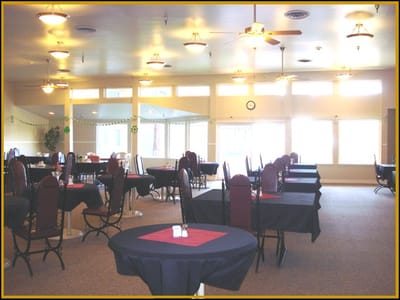 Dining room with tables and chairs set up