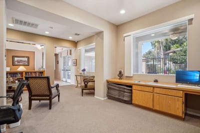 Interior view of a common area with seating and a desk