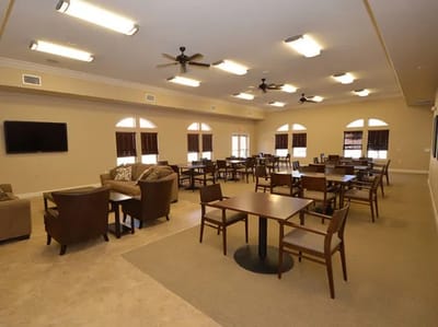 Bright common area with tables and chairs