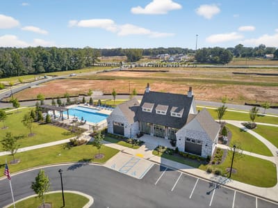 Aerial view of the facility with pool and landscaped areas