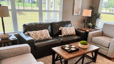 Comfortable common area with seating and natural light