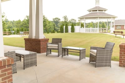 Outdoor seating area with gazebo in the background