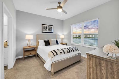 Brightly decorated resident bedroom with window view