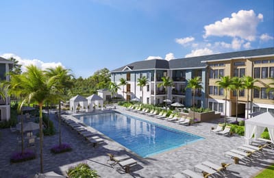 Outdoor pool area with cabanas and palm trees