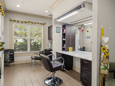 Interior view of a salon area with styling chairs and mirrors