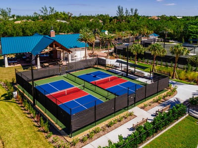 Aerial view of tennis courts and pavilion at The Woodlands