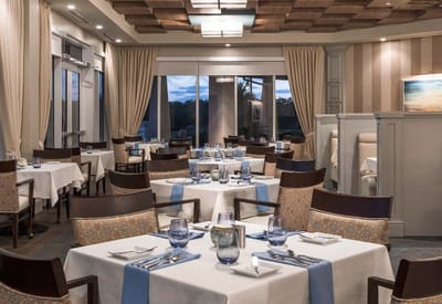 Elegant dining room with set tables and chairs