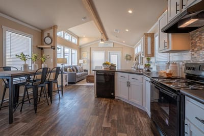 Bright and airy common area with kitchen and seating