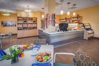 Bright dining area with meals and a coffee station