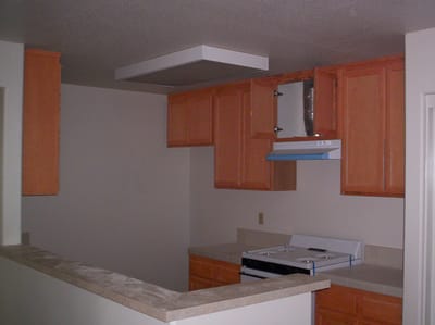 Interior view of a kitchen with orange cabinets