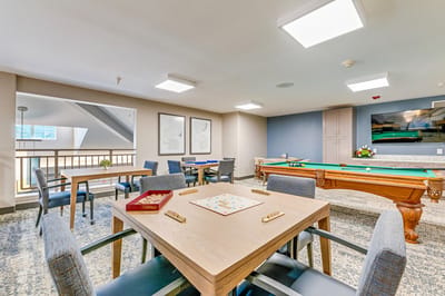 Common area with tables and pool table