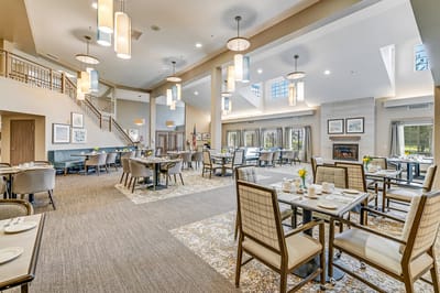 Dining area set with tables and breakfast items