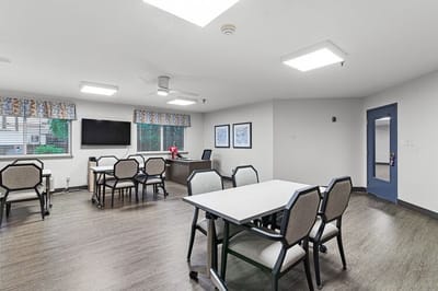 Bright common area with tables and chairs
