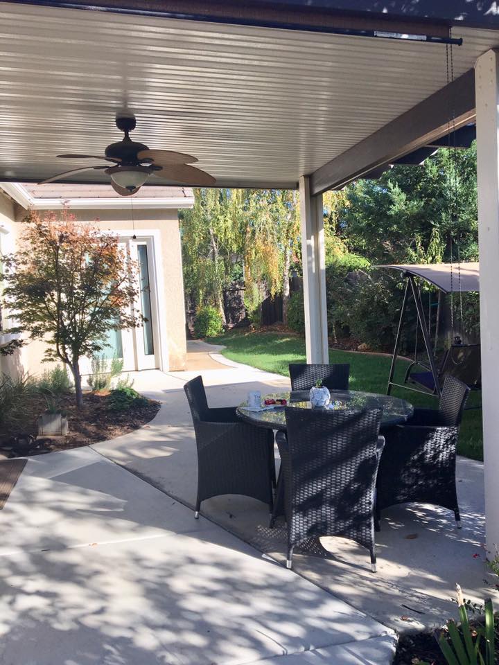Outdoor seating area with a table and chairs