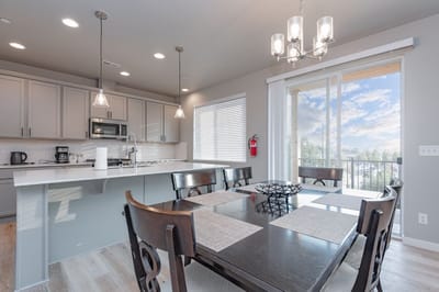 Bright dining area with modern kitchen features