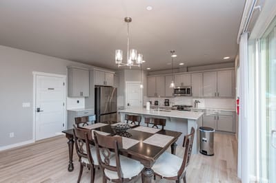 Modern kitchen with dining table and chairs
