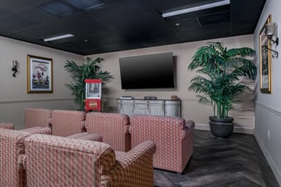 Cozy common area with patterned chairs and greenery