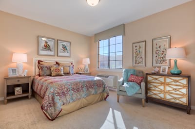Well-decorated bedroom with colorful bedding and artwork
