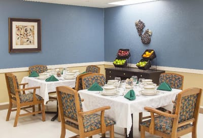 Dining area set up for a meal with fresh fruit