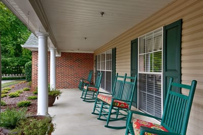 Porch area with rocking chairs and garden