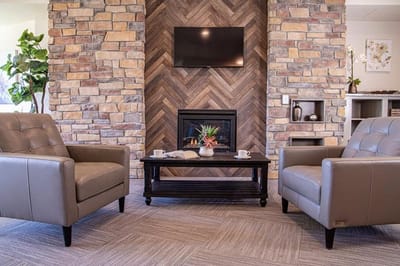 Cozy lounge area with comfortable seating and a fireplace.