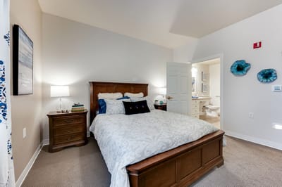 Cozy private bedroom with a neatly made bed