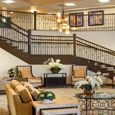 Elegant lobby area with comfortable seating and stairs
