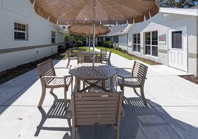 Outdoor seating area with tables and umbrellas