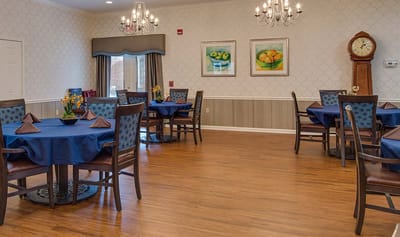 Dining area with tables and chairs in a cozy setting