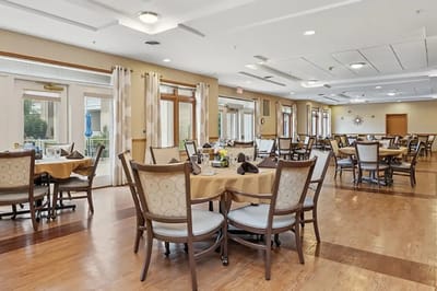 Bright dining room with tables set for meals