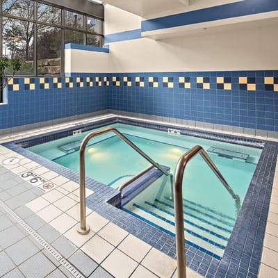 Hydrotherapy pool area with blue tiles