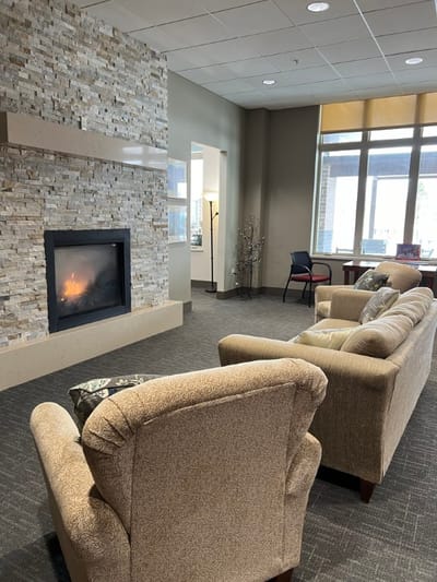 Cozy common area with seating and fireplace