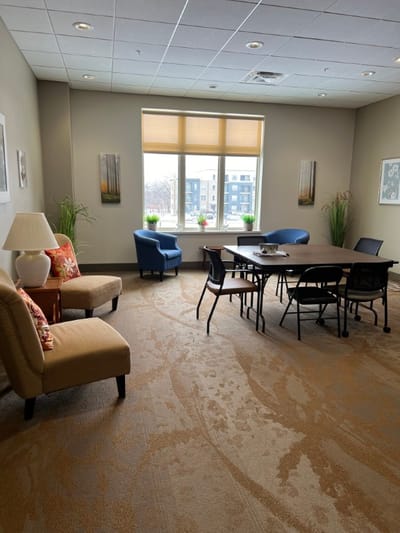 Bright common area with seating and natural light