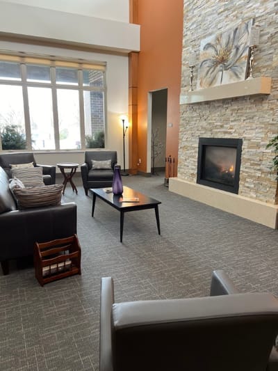 Interior common area with seating and fireplace