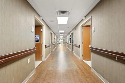 Well-lit interior hallway of the nursing home