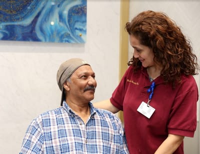 Staff member interacting with a resident in a common area