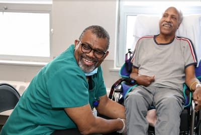 Staff member engaging with a resident in a facility