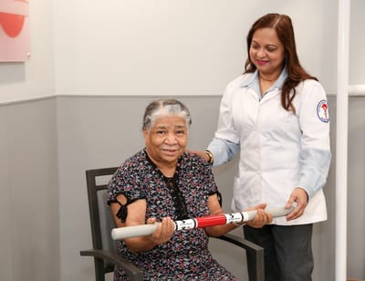 A resident engaging in therapy with a staff member