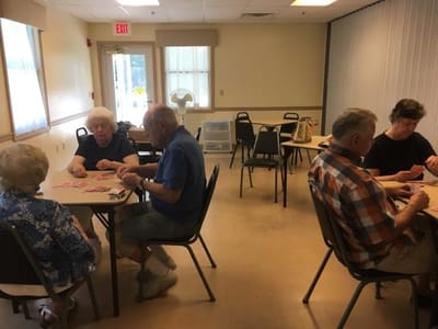 Residents playing bingo in a common area
