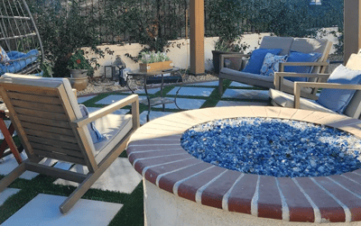 Outdoor seating area with a fire pit and lounge chairs